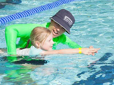 Child learning to swim